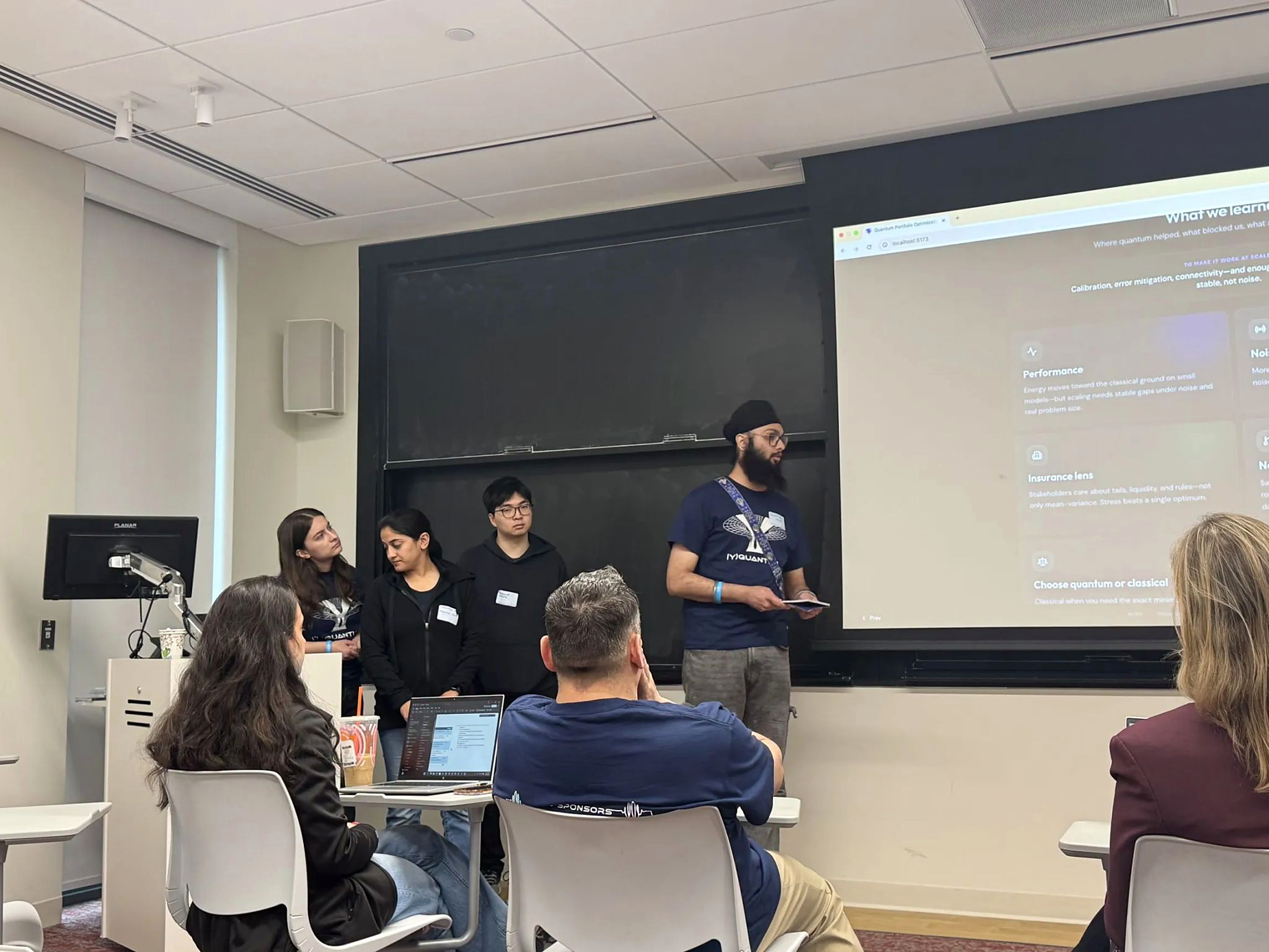 Tanish Singh Rajpal and team members presenting their portfolio-optimization project to judges at YQuantum