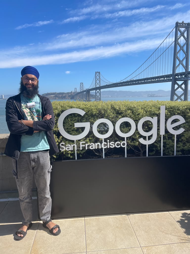 Tanish Singh Rajpal beside the Google San Francisco sign